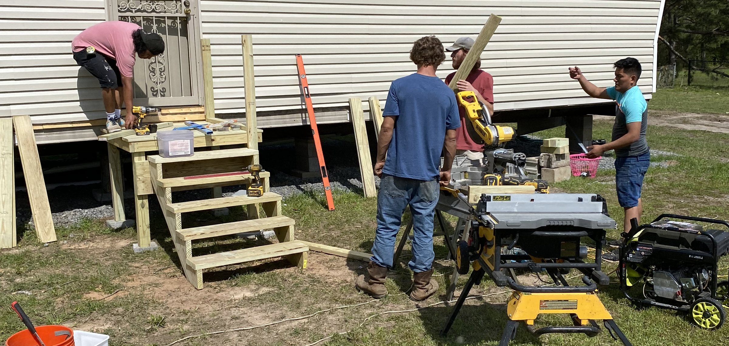 JT's Home Repair crew building new porch stairs in Central Arkansas